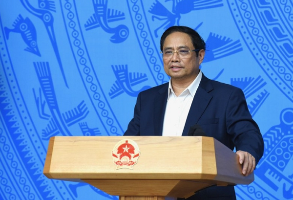 Thủ tướng Phạm Minh Chính nêu rõ, Ban Chỉ đạo quốc gia thống nhất đánh giá bệnh COVID-19 đã đủ điều kiện đáp ứng các tiêu chí của nhóm bệnh truyễn nhiễm nhóm B theo quy định tại Luật Phòng, chống bệnh truyền nhiễm - Ảnh: VGP