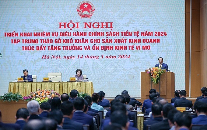 Thủ tướng Phạm Minh Chính chủ trì hội nghị về chính sách tiền tệ, tháo gỡ khó khăn cho sản xuất, kinh doanh, ngày 14/3. Ảnh: VGP