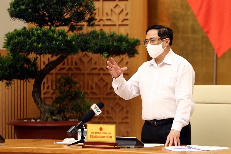 Thủ tướng Phạm Minh Chính phát biểu tại cuộc làm việc với các nhà khoa học, các đơn vị, doanh nghiệp tham gia nghiên cứu, sản xuất vaccine phòng chống COVID-19 tại Việt Nam.