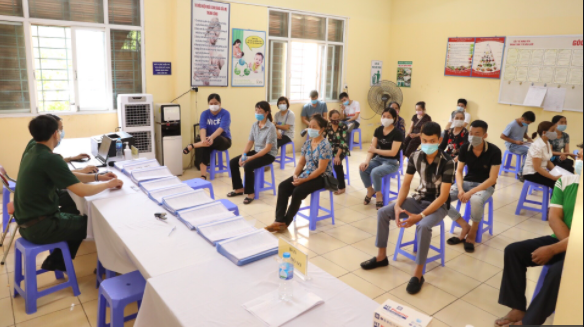 Các tình nguyện viên tham gia tiêm thử nghiệm vaccine ngừa COVID-19 của Việt Nam - Ảnh: VGP/Đình Nam